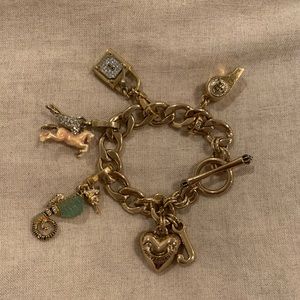 Juicy Couture gold charm bracelet with charms